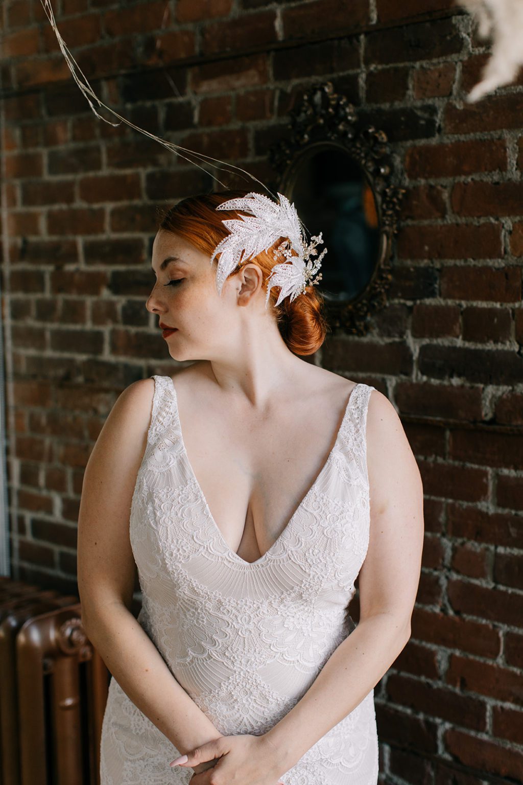 white jewelled leaf headband on bride