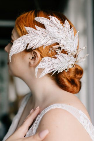 white jewelled leaf headband on bride updo