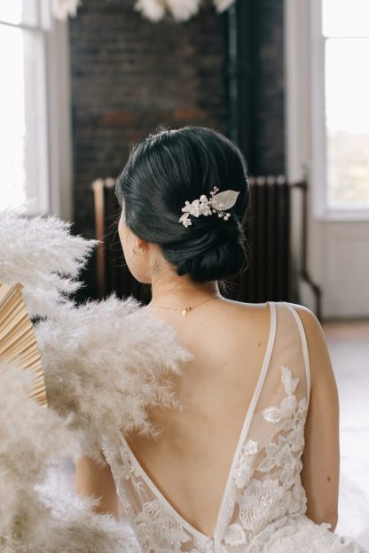 silver floral hair pin on bride updo