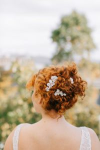 porcelain floral hair comb on bride updo