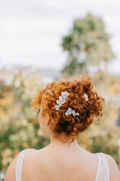 white porcelain floral hair pins bridal updo