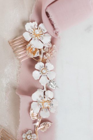 gold hair comb with white flowers