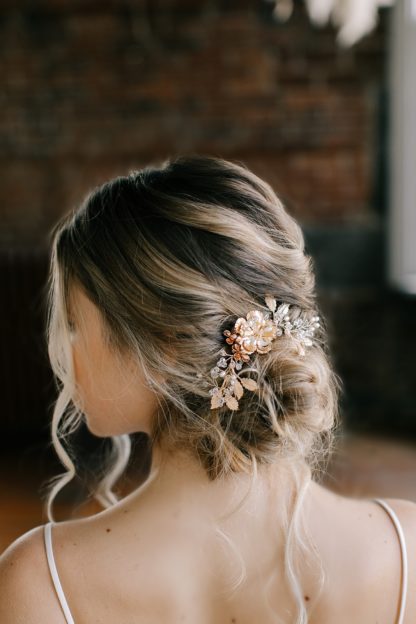 gold hair comb with metallic flowers bridal updo