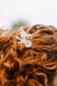 gold floral hair pins in updo