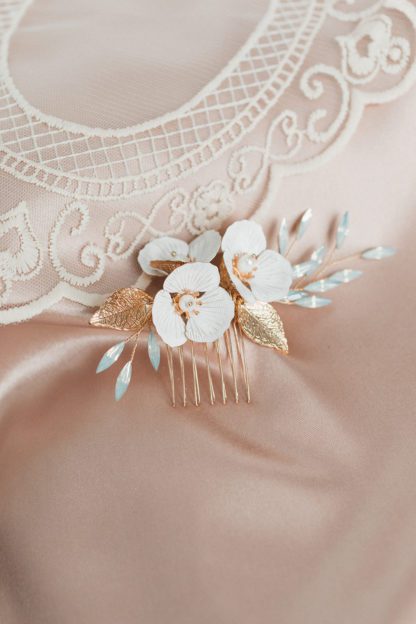 white flowers on gold hair comb