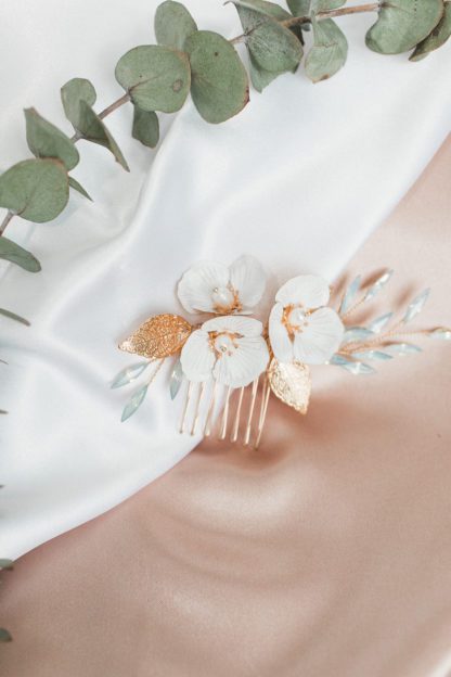 white flowers on gold hair comb