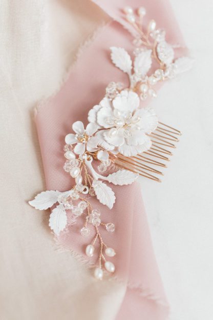 gold hair comb with white flowers